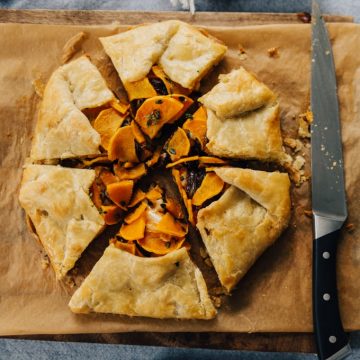 Butternut squash galette is one of my favorite ways to showcase this sweet, nutritious fall vegetable. This galette is sweet, nutritious, and hearty, and a gorgeous centerpiece for a gathering with friends. #vegetarian #wholefood #realfood #butternutsquash