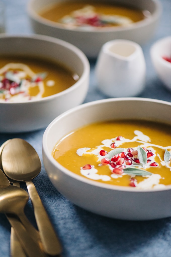 Paleo butternut squash soup with pomegranate seeds is a seasonal nutritional powerhouse. Delicate butternut squash and rich bone broth come together for a velvety soup that is the perfect balance of sweet and savory. Pomegranate seeds add a fun little pop to every bite. This soup is naturally paleo and gluten-free. #wholefood #realfood #paleo #whole30