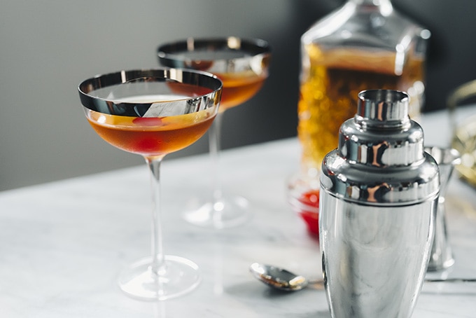 Cherry bourbon manhattan cocktail. Classic manhattan prepared with sweet cherry Red Stag bourbon, sweet vermouth, and bitters. DC food and beverage photographer. #cocktail #winter #bourbon #redstag #cherrybourbon #wintercocktail