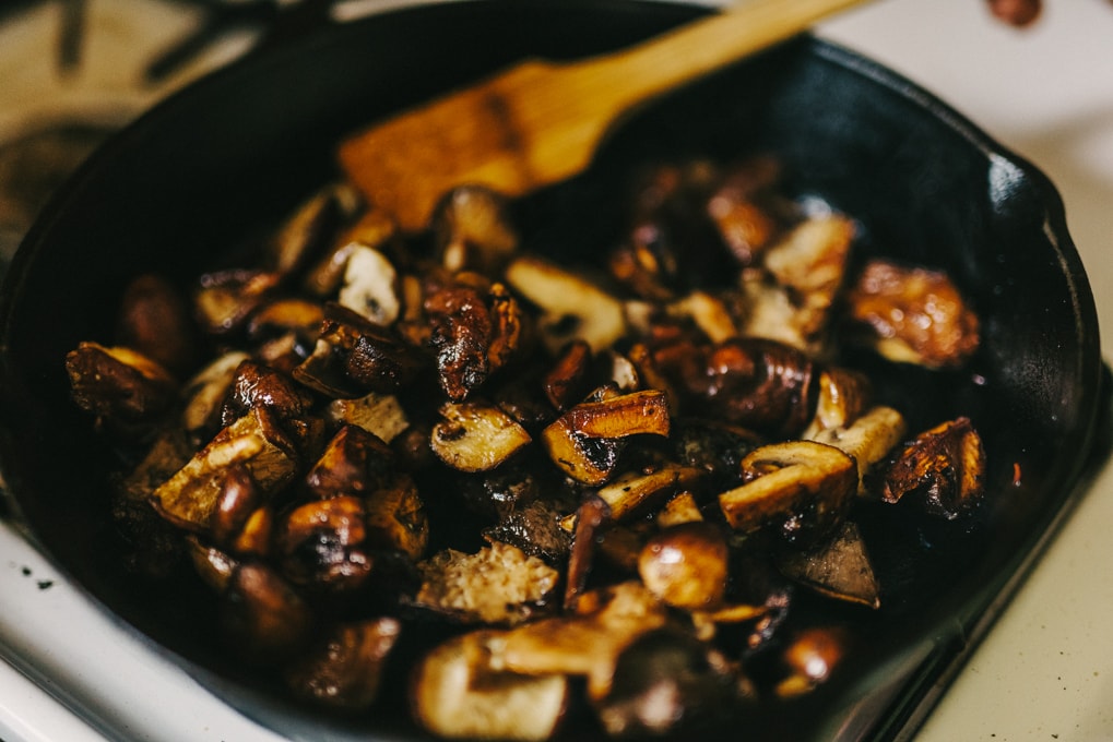 This warm mushroom salad with potato and wilted greens is one of my favorite fall salads. Crispy, pan-seared mushrooms are the star, tossed with roasted potatoes and fall greens for a hearty and satisfying meal. #paleo #wholefood #realfood #fall #autumn