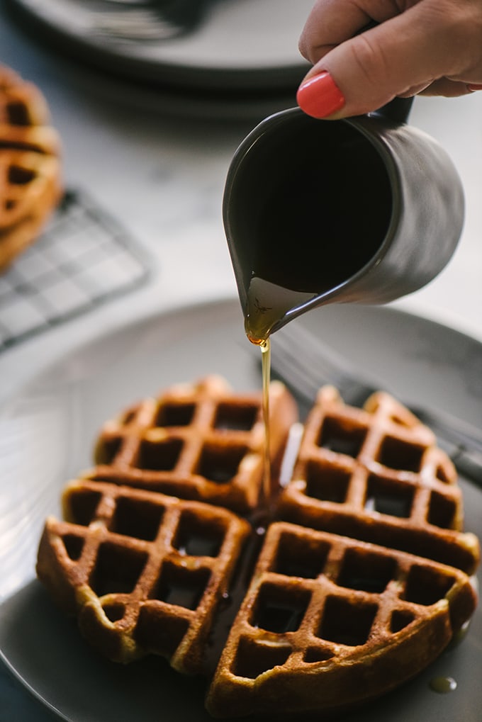 These whole grain waffles are crispy on the outside, and cakey on the inside. They're completely sugar free and made with real, whole food ingredients. #wholegrain #waffles #breakfast #recipe