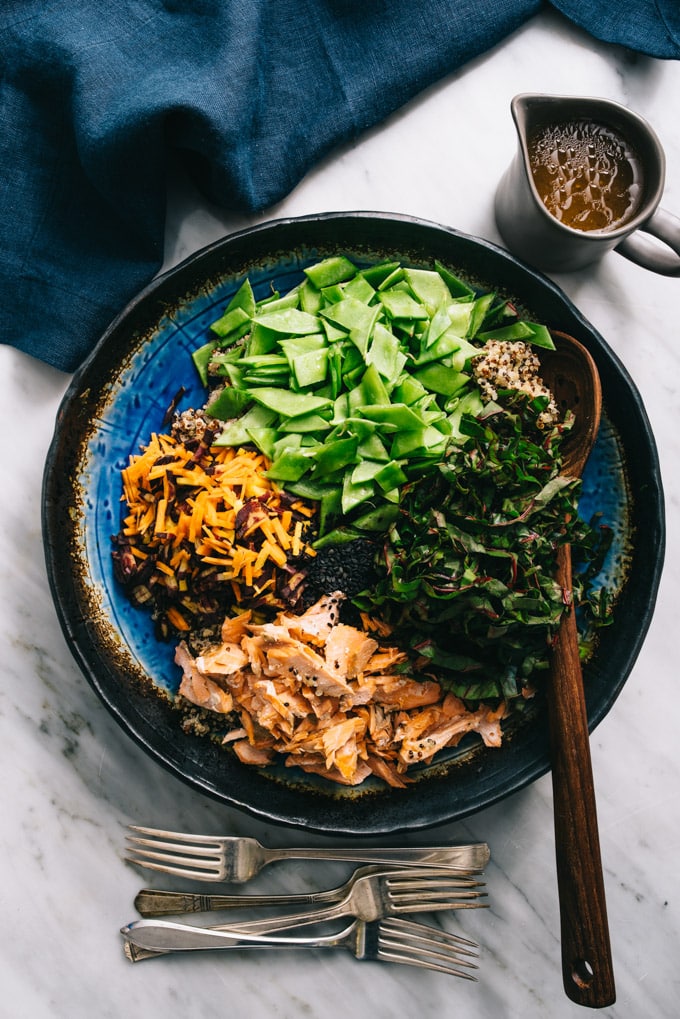 This salmon quinoa salad with honey soy dressing checks all of my weeknight dinner requirements - healthy, easy, fast, and delicious. It's one of my favorite recipes for using up leftover salmon! #glutenfree #salmon #salad #quinoa #salmonquinoa
