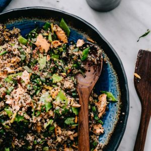 This salmon quinoa salad with honey soy dressing checks all of my weeknight dinner requirements - healthy, easy, fast, and delicious. It's one of my favorite recipes for using up leftover salmon! #glutenfree #salmon #salad #quinoa #salmonquinoa