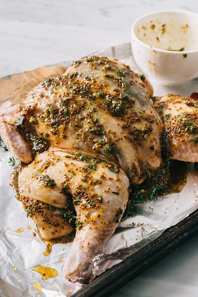 This honey mustard spatchcock chicken is an easy, delicious weeknight meal that comes together quickly with little prep time. Adding root vegetables to the sheet pan makes preparing a nutritious side dish a snap. Paleo and Whole30 friendly!