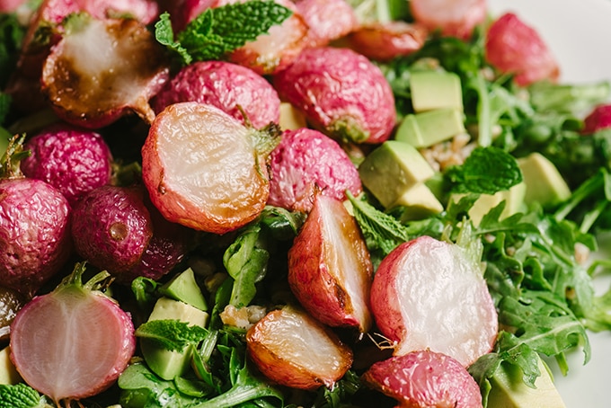 Roasted radishes are sweet, tender and juicy. While perfect on their own with a little butter and salt, they really shine in a warm grain salad tossed with mint salsa verde. 