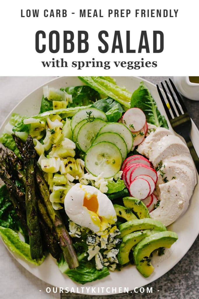 A cobb salad with roasted spring vegetables, chicken, and a soft boiled egg.
