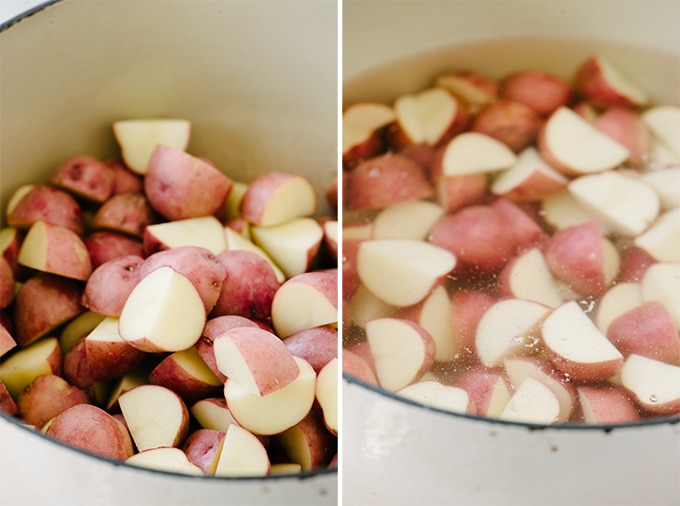 Quartered new potatoes in a large pot covered with water.