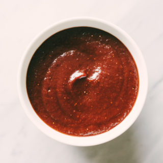 This paleo strawberry BBQ sauce is sweet and tangy, and a perfect companion to juicy grilled bone-in pastured chicken. Be sure to make an extra batch of this paleo BBQ sauce to tuck into the freezer for a fast, easy, weeknight dinner. #healthy #wholefood #realfood #eatclean #paleo