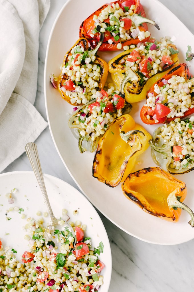 Grilled mexican street corn stuffed peppers are a fast, easy, vegetarian meal. This delicious real food + whole food recipe is packed with vegetables and an easy weeknight dinner, lunch, or side dish. #healthy #wholefood #realfood #vegetarian