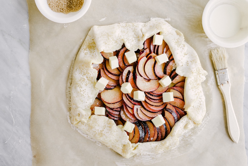 This sweet and subtle cardamom plum galette is a delicious late summer stone fruit dessert recipe. Easy, tasty, whole food dessert recipe! #wholefood #realfood #organic #recipe #stonefruit