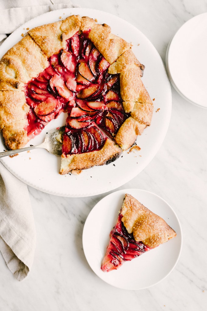 This sweet and subtle cardamom plum galette is a delicious late summer stone fruit dessert recipe. Easy, tasty, whole food dessert recipe! #wholefood #realfood #organic #recipe #stonefruit