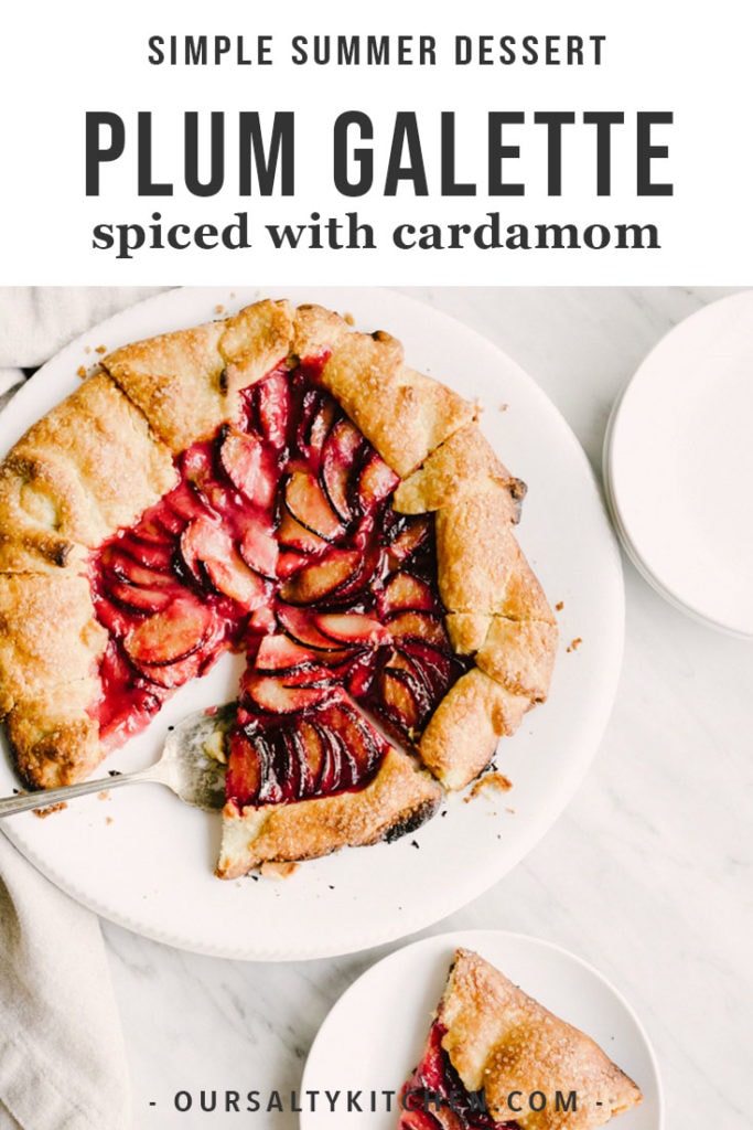 Plum galette spiced with cardamom on a white serving platter with one slice on a small white dish.