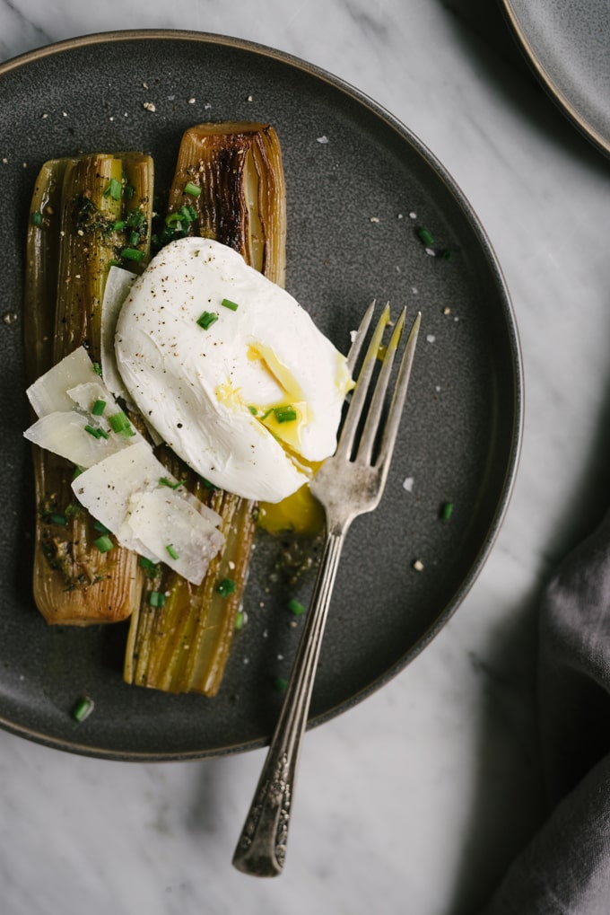 Braised leeks are incredibly simple and deceptively tasty. While perfect as a side dish, I like to turn them into a simple and nutritious whole food dinner by adding a poached egg. #wholefood #realfood #glutenfree #leeks #poachedegg