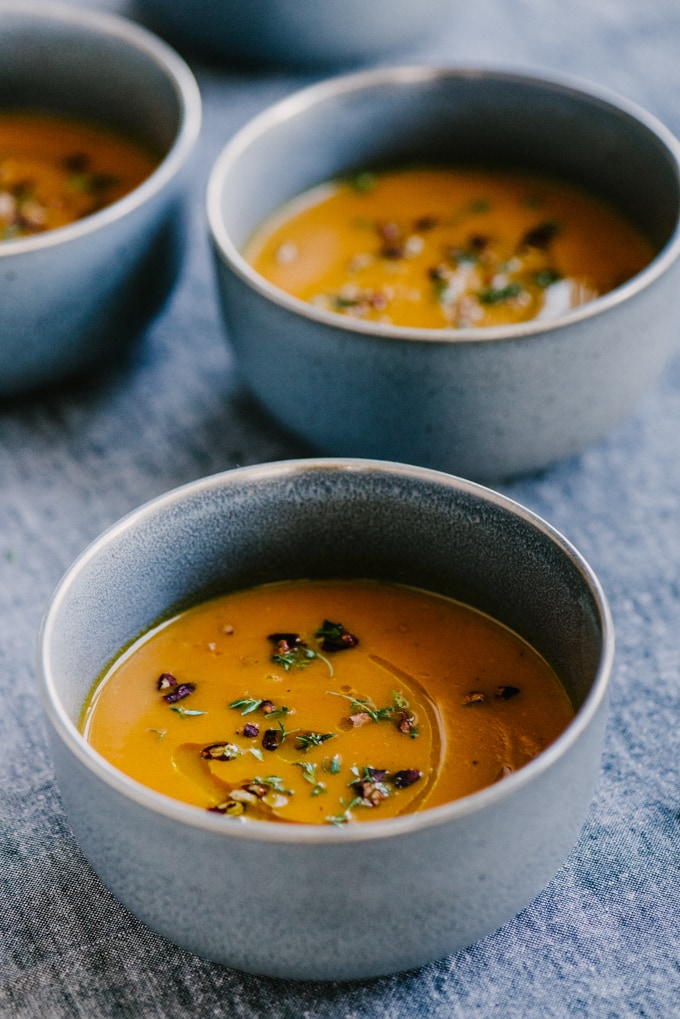 This roasted carrot apple soup is like a big hug - warm, comforting, and nourishing for the body and soul. It's a nutty and sweet fall soup recipe that's naturally paleo, whole 30 and gluten-free. #paleo #whole30 #fall #soup #wholefood