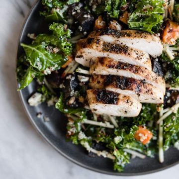 This kale chicken salad is the quintessential recipe for a fall harvest salad. It's made with super crispy apples, kale, grilled apple cider chicken, and warm potatoes, then dressed with a sweet and tart maple cider vinaigrette. It's an easy, fast, and deeply nutritious weeknight autumn dinner. #wholefood #realfood #healthy #glutenfree #fall #salad