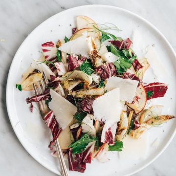 You will love this roasted fennel salad recipe! Roasted fennel is sweet and nutty and pairs perfectly with crispy apples and spicy radicchio. This easy fall salad recipe is one of my go-to paleo, Whole30 and vegan recipes when fennel is in season. It's a flavor packed side dish that's impressive enough for dinner parties and Thanksgiving dinner, but easy enough for a weeknight.