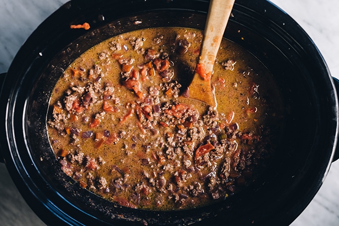 How to make crockpot bolognese, an easy, kid friendly weeknight dinner! Bolognese sauce with grass fed ground beef, mirepoix, red wine, herbs, and cream in the crockpot read to simmer long and slow.