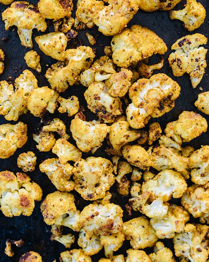 How to prepare roasted cauliflower salad. Bite sized cauliflower florets roasted with turmeric to a golden, vibrant hue. Nutty and sweet.