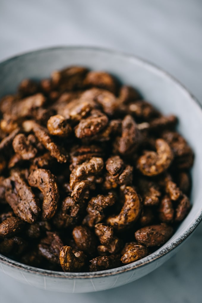 A bowl of paleo and sugar free gingerbread spiced nuts.