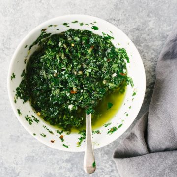 A bowl of salsa verde - a vegan and whole30 Italian parsley green sauce.