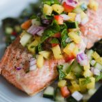 This healthy, colorful cucumber mango salsa is one of my favorite toppings for simple pan-seared wild salmon. It's crunch, tangy, slightly tweet, and perfectly tart. This a fast and easy whole30 recipe that's ready in just 20 minutes! Get the recipe, plus my tips for restaurant perfect seared salmon every single time. Simple and healthy has never tasted so good.