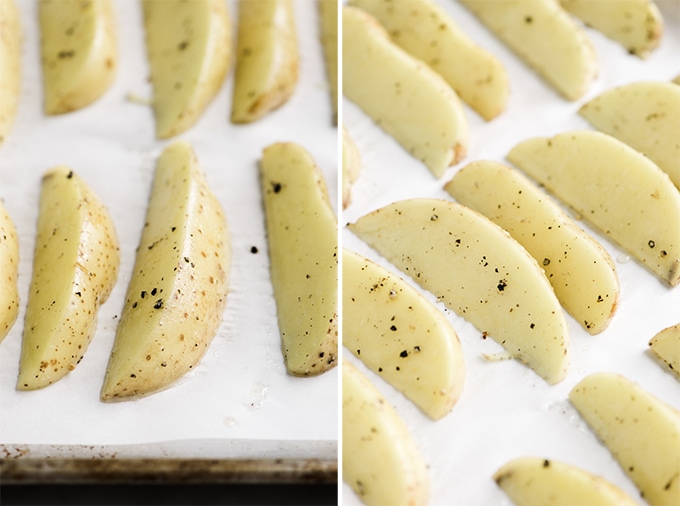Yukon gold potato wedges tossed with olive oil, salt, and pepper on a parchment lined baking sheet.