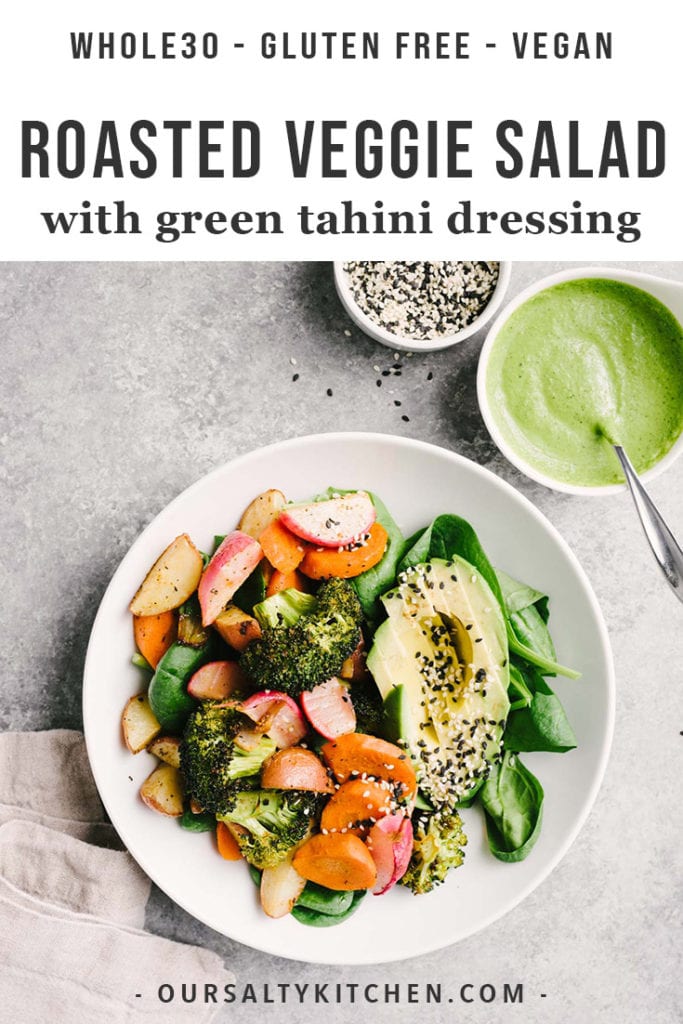 Roasted vegetable salad with avocado, spinach, and sesame seeds and a side of green tahini dressing.