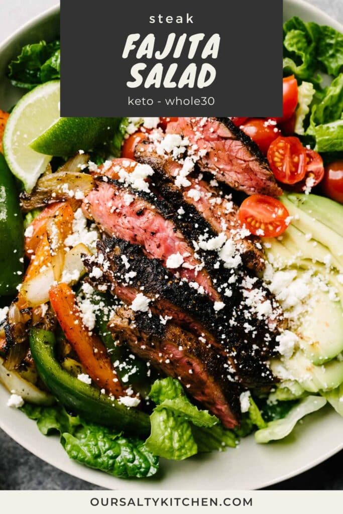 Side view, seared steak and sauteed bell peppers over romaine lettuce with tomatoes, avocado and queso fresco; title bar the top reads "steak fajita salad - keto and whole30".