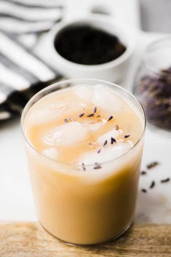 An iced london fog tea latte brewed with lavender and made with vanilla extract, stevia, and cashew milk. A healthy, refreshing paleo iced tea latte!