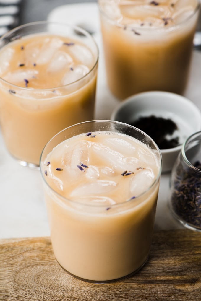 Three iced london fog tea lattes brewed with lavender and sweetened with vanilla extract, stevia, and cashew milk. A healthy, refreshing paleo iced tea latte!