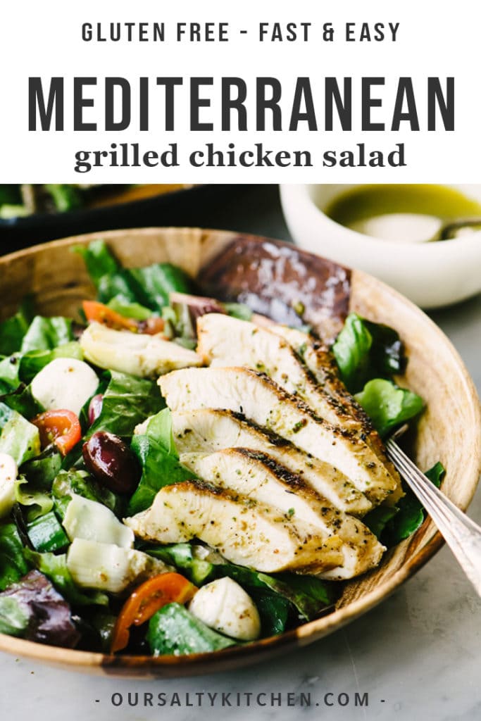 A bowl of gluten free mediterranean grilled chicken salad with olives, artichokes, and oregano vinaigrette.