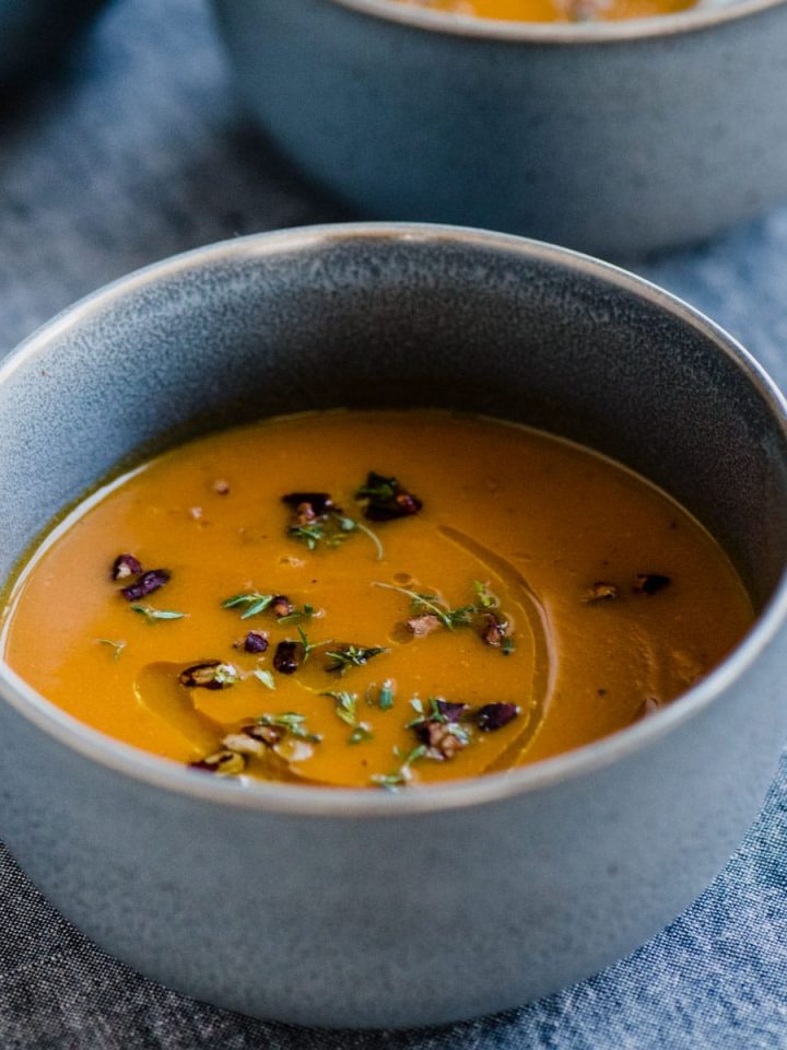 This roasted carrot apple soup is like a big hug - warm, comforting, and nourishing for the body and soul. It's a nutty and sweet fall soup recipe that's naturally paleo, whole 30 and gluten-free. #paleo #whole30 #fall #soup #wholefood