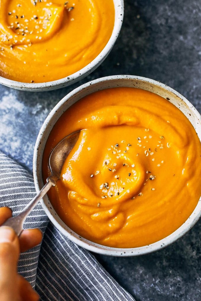 A bowl of creamy curry butternut squash whole30 soup. 