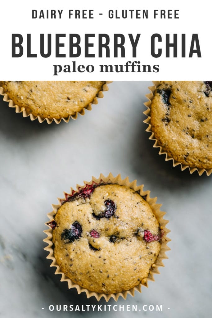 Three paleo blueberry muffins on a marble table.