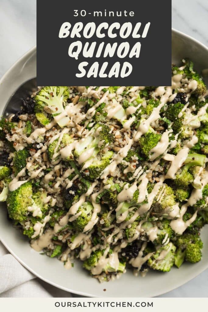 A serving spoon tucked into a large tan serving bowl filled with broccoli quinoa salad - roasted broccoli, quinoa, sunflower seeds, dried cherries, mint, and creamy sunbutter dressing; title bar at the top reads "30-minute broccoli quinoa salad".