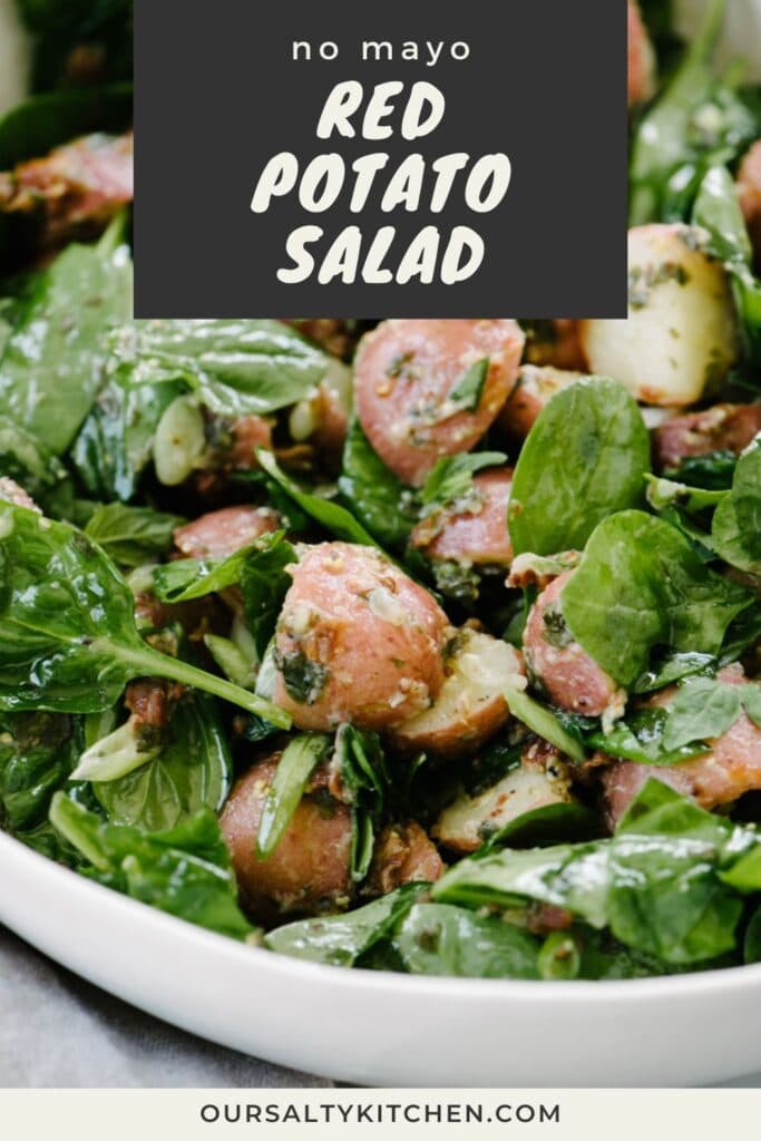 Side view, baby red potatoes tossed with basil vinaigrette and baby spinach; title bar at the top reads "no mayo red potato salad".