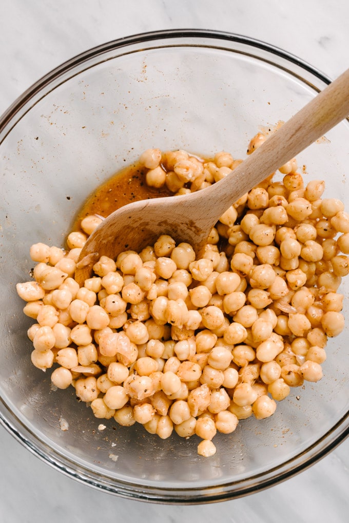 A bowl of chickpeas marinated with lemon juice, olive oil, paprika, and salt. 