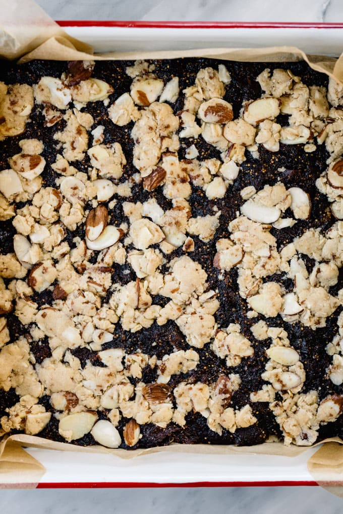 Fig bars layered into a baking dish ready to be baked.