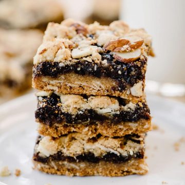 A stack of homemade fig bars on a white plate.