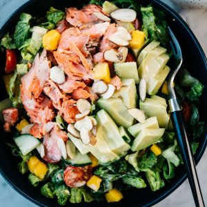 From above, salmon and avocado salad with mango and lemon dressing.