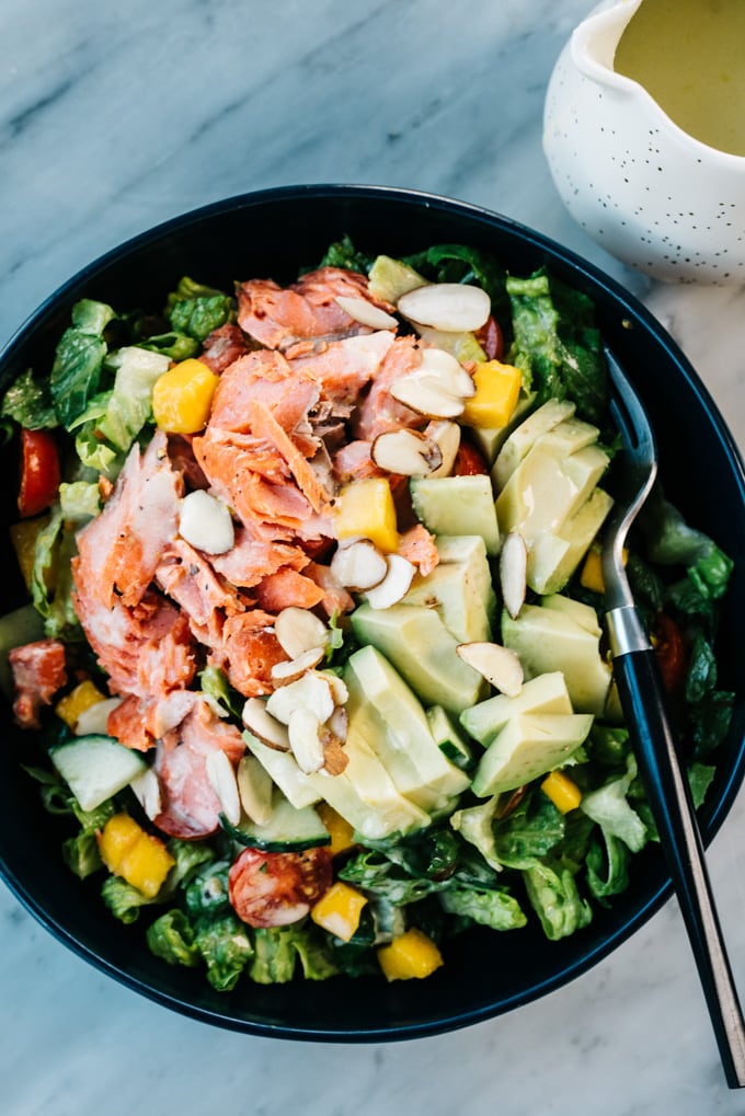 From above, salmon and avocado salad with mango and lemon dressing.