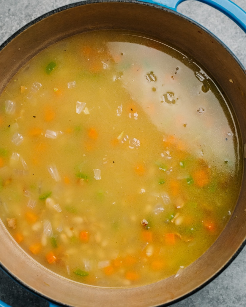 White bean soup in a pot before simmering.