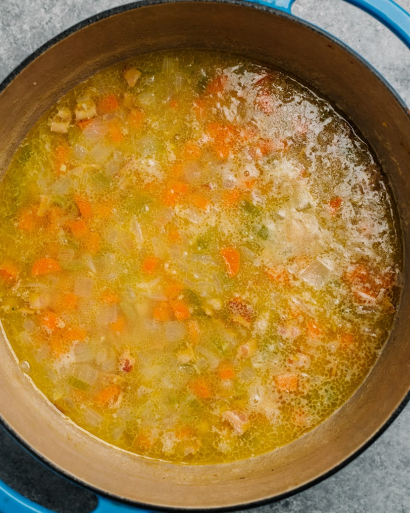 White bean soup in a pot after simmering.