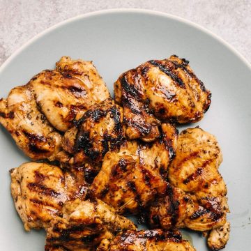 A platter of grilled balsamic chicken thighs.