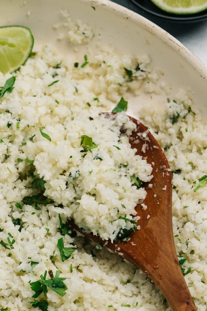 Detail image of cilantro lime cauliflower rice in skillet.