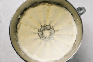 Butter beaten until light and fluffy in the bowl of a food processor.
