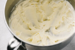 Butter beat with confectioners sugar until light and fluffy in the bowl of a stand mixer.