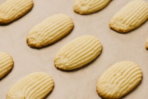 Italian butter cookies on a baking sheet fresh from the oven.