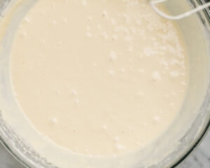 Plain cheesecake filling in a mixing bowl.