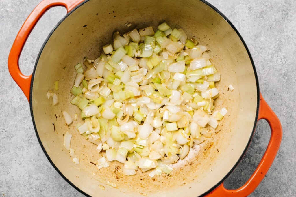 Sautéed onions and leeks in a dutch oven.